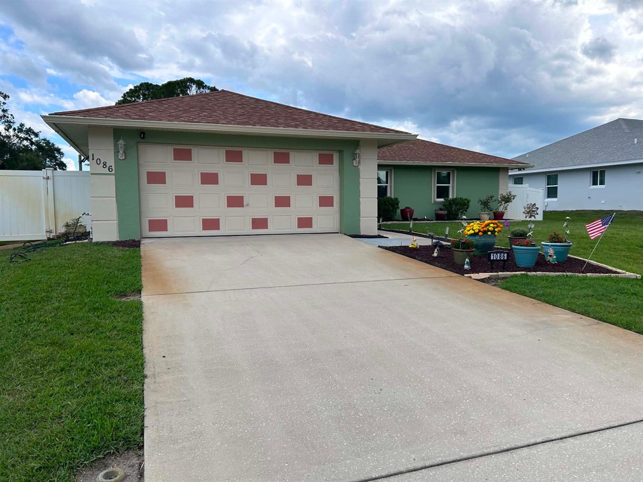 Freshly repainted house exterior in Brevard County, FL — the previous Paint Craft of Brevard coat lasted 23 years before this repaint