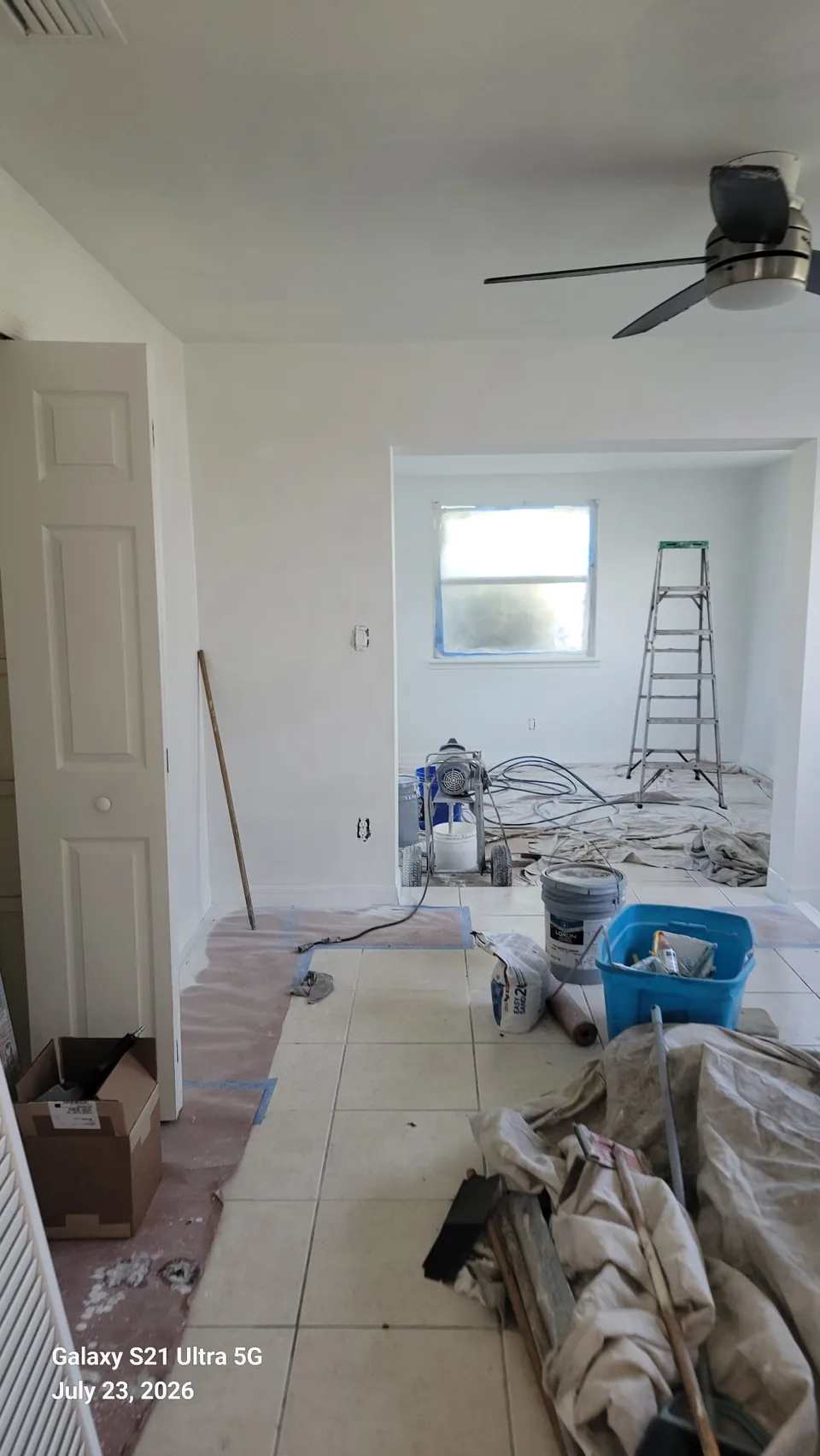 Interior living room masked and prepped for spray painting in Brevard County, FL