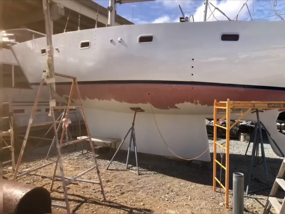 Sailboat with red bottom paint applied below the waterline in Brevard County, FL