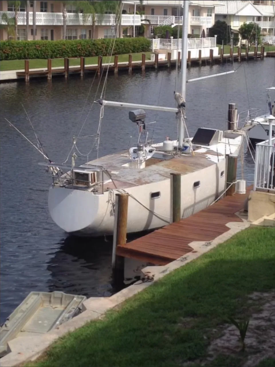 Sailboat moored at a private canal dock in Brevard County, FL