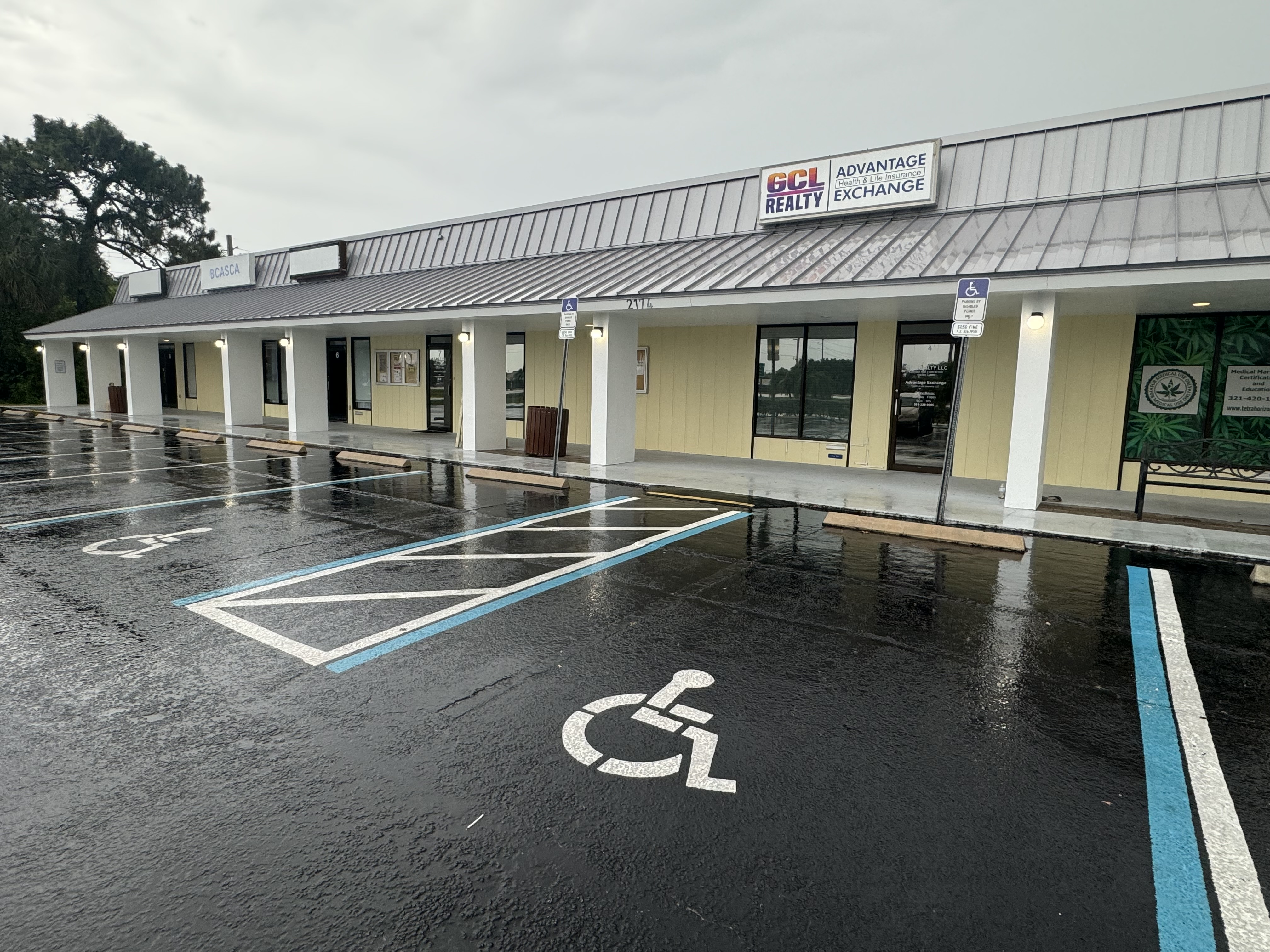 Commercial painting project in Melbourne FL — shopping center exterior repaint by Paint Craft of Brevard