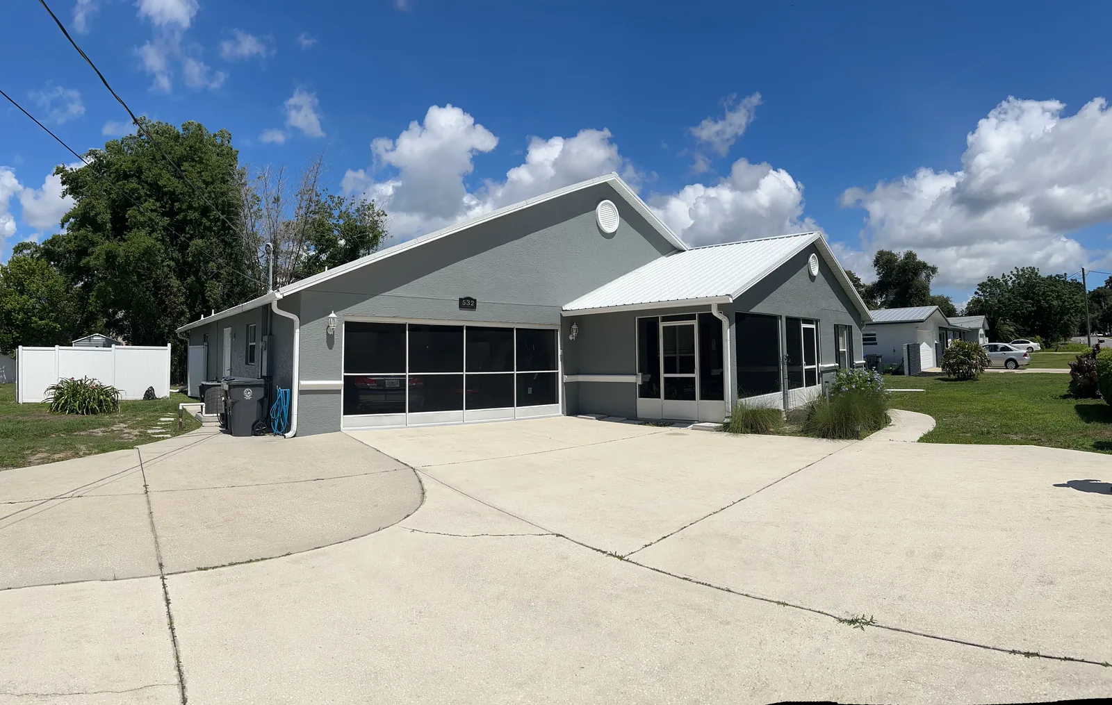 Modern gray home exterior repaint in Brevard County FL by Paint Craft of Brevard