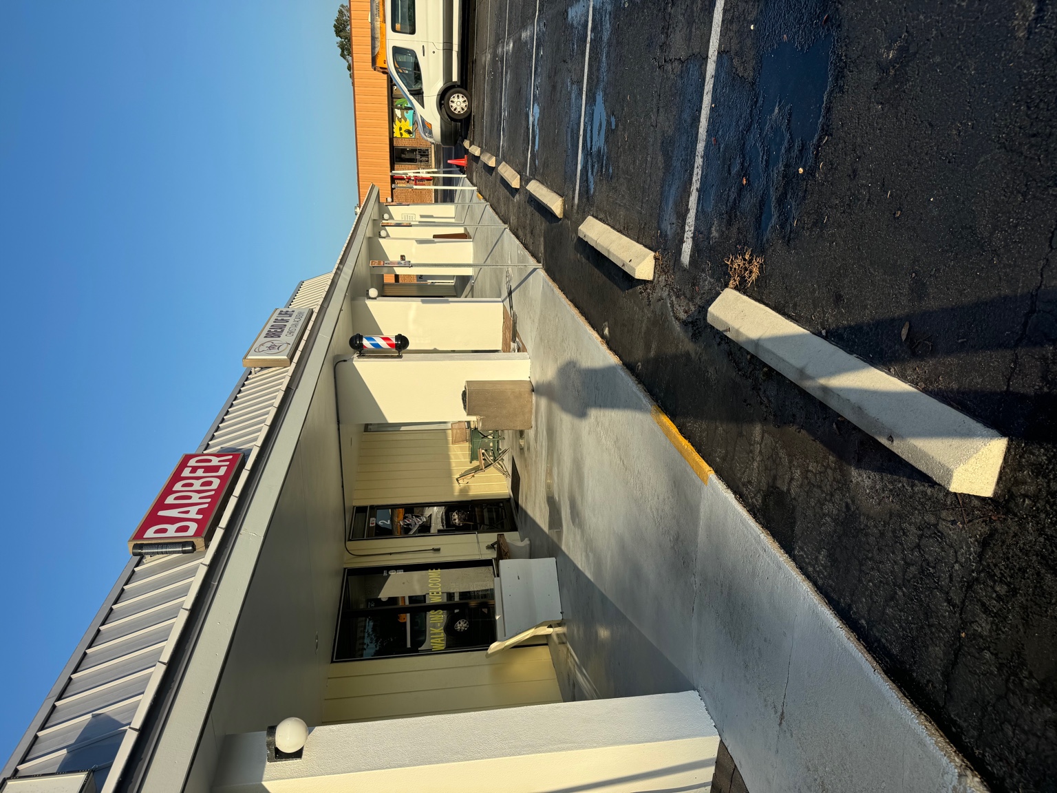 Commercial painting project in Melbourne FL — shopping center exterior repaint by Paint Craft of Brevard